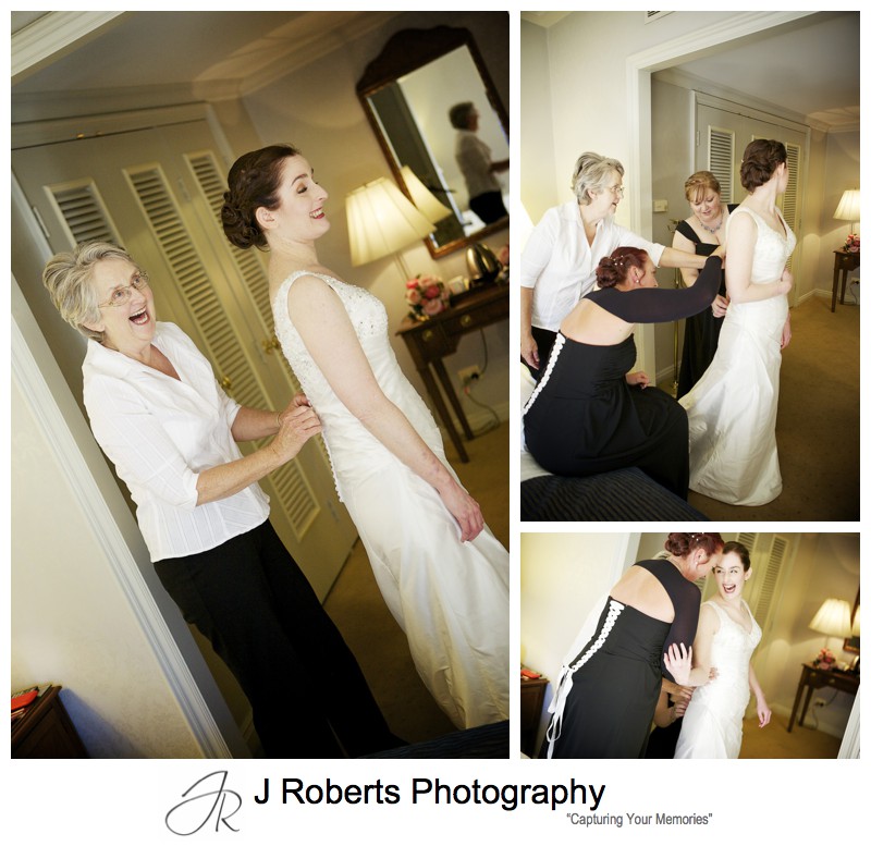 Bride getting dressed with her bridesmaids - sydney wedding photography